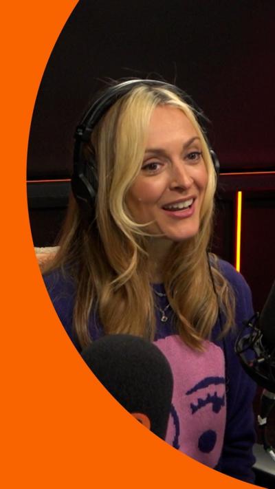 Fearne Cotton sits in front of a microphone