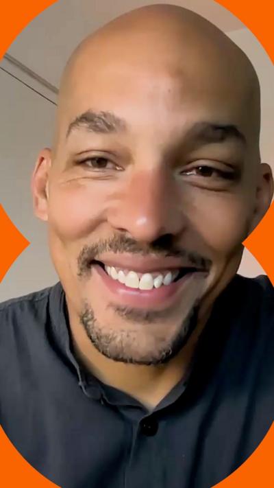 Light Watkins smiling at the camera 