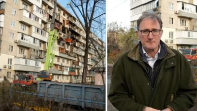 Split screen image showing James Landale on the right and a damaged multi-storey building in Kyiv on the left 