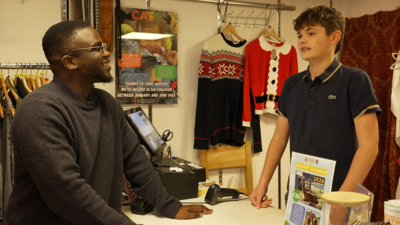 De-Graft and boy in shop