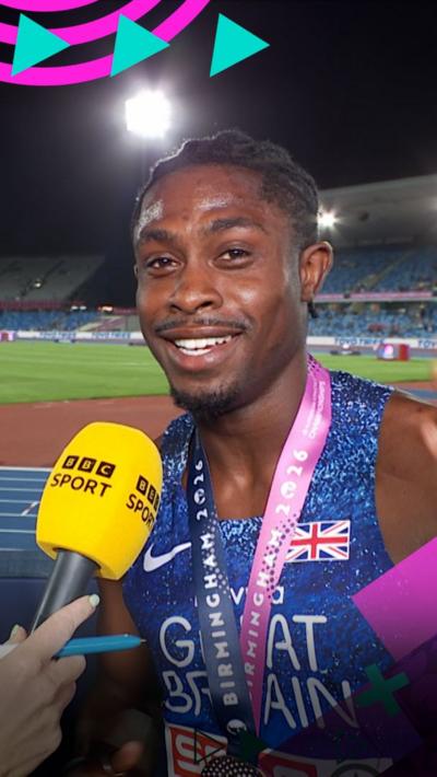 Jeremiah Azu looking at the camera and smiling