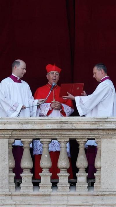 Announcement made from balcony with man speaking in to microphone