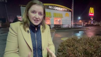 BBC correspondent outside McDonald's 