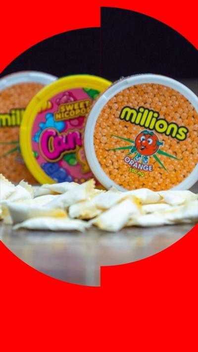 Three circular sweet containers and a pile of nicotine pouches