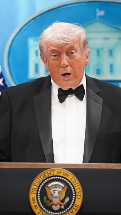 Trump in tuxedo at podium