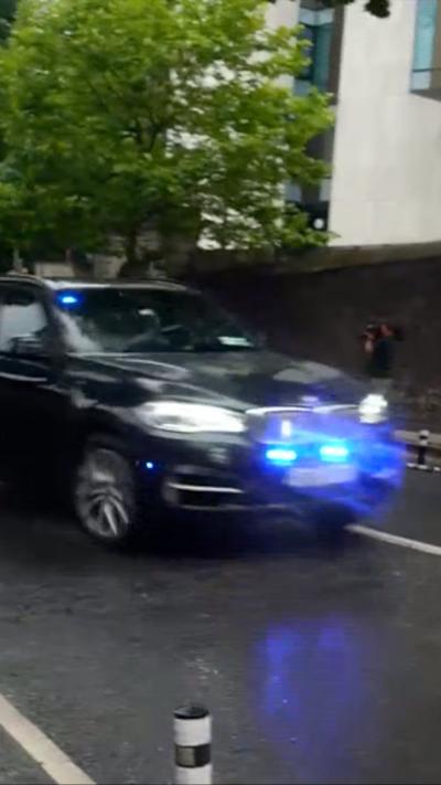 Black vehicle with blue flashes on