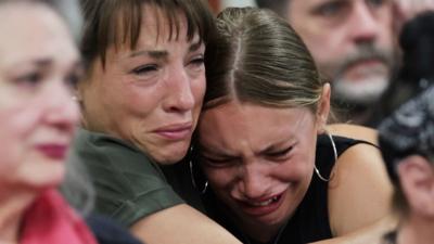 Dylan Mortensen gets a hug after speaking at the sentencing hearing of Bryan Kohberger.