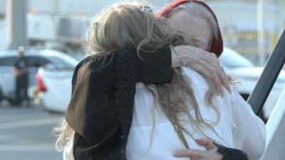Barbie Reynolds hugs her daughter
