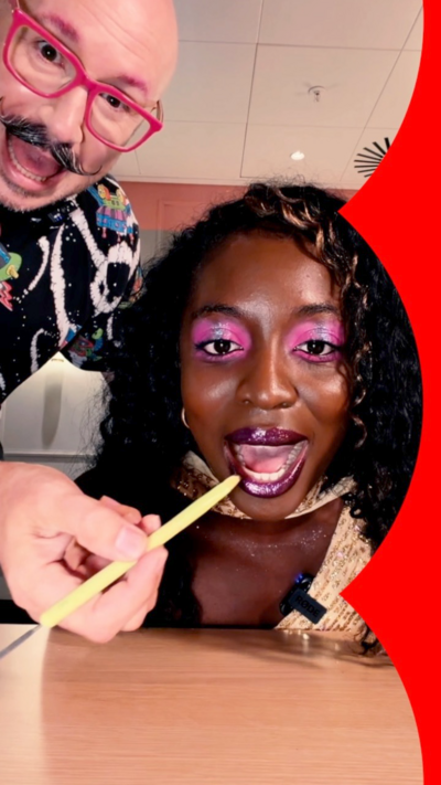 A woman having pink make-up applied