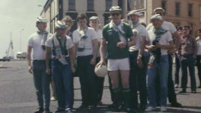 Northern Ireland football fans in Carrickfergus prepare to head out to Spain in 1982