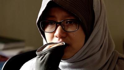 Nada Fedulla cries as she asks for help to return home to Indonesia.