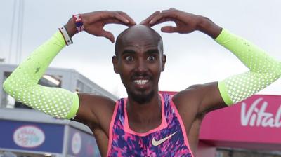 Mo Farah celebrates winning The Big Half