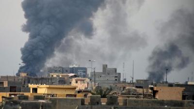 Smoke rises from Islamic State positions following a U.S.-led coalition airstrike as Iraqi Security forces advance their position in downtown Ramadi