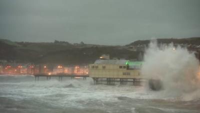 Wave hitting a pier