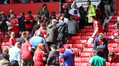 Fans leaving Old Trafford