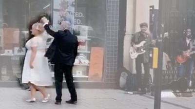 Couple dance in street