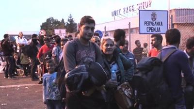 Refugees queue at Serbia-Hungary border