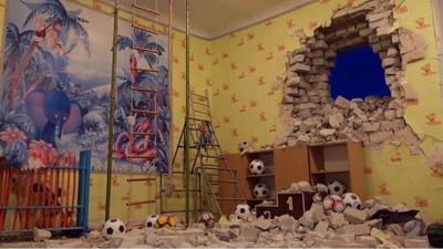 Rubble surrounding a hole in a wall at a Ukrainian nursery