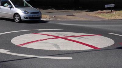 Roundabout painted with England flag