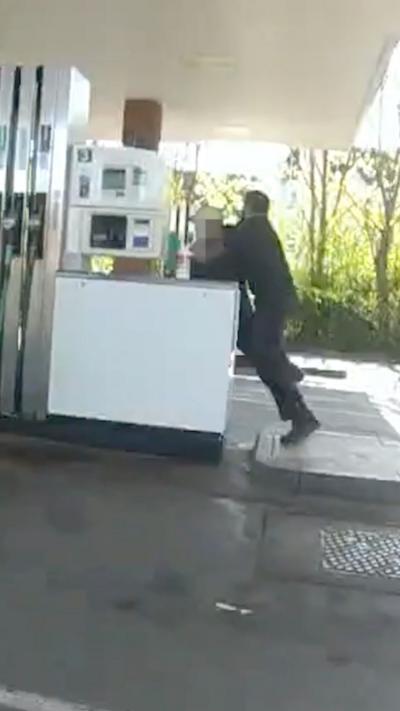 CCTV footage shows a police officer tackling a man near a petrol pump