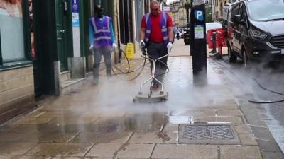 Cleaning a street in Bradford