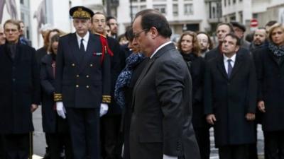 President Hollande unveils a commemorative plaque outside the former offices of French weekly satirical newspaper Charlie Hebdo