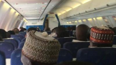 People on a plane in Nigeria