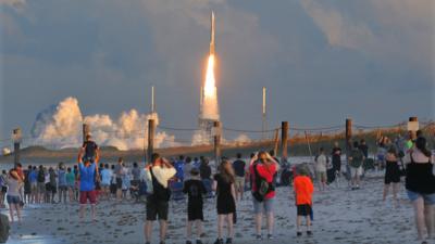 Spectators watch the launch