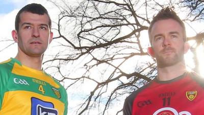 Donegal's Frank McGlynn and Down skipper Mark Poland