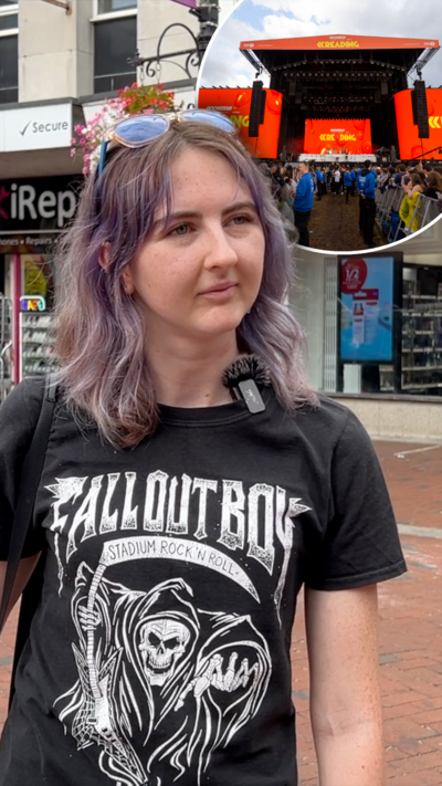 A girl with short light purple hair and a black t-shirt which says 'Fallout Boy' on the front.