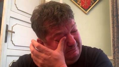 Scottish expat Stuart McKenzie wipes a tear from his eye