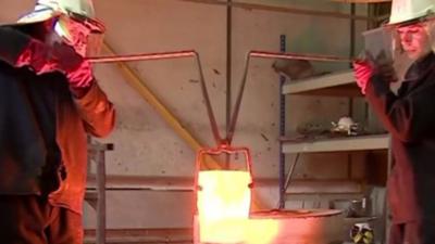 Craftsmen forging metal