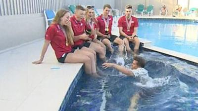 BBC Sport presenter Mike Bushell falls into the pool