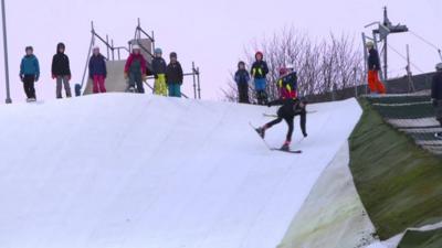 Man on skis falling over