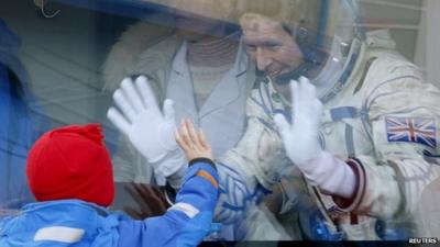 British astronaut Tim Peake waves to his children