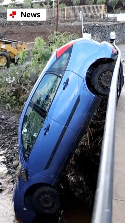 A car that is vertical on its bonnet