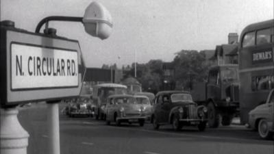 Rows of traffic with a road sign that says 'N. Circular Rd.'