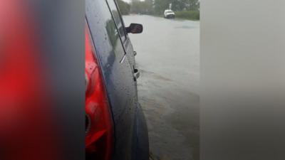 Car stuck in flood water