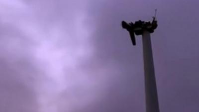 The strong winds caused the blades to shear off and land in a nearby field.