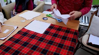 Volunteers making feminine hygiene products