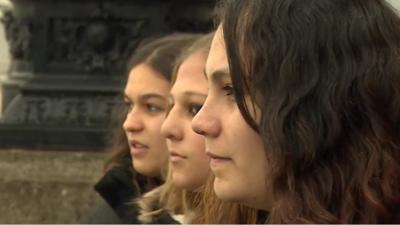 Three girls from Tristan da Cunha looking at the Thames.