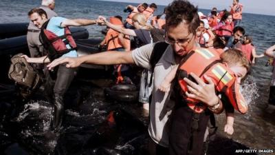 Refugees and migrants arrive on Eftalou beach, west of the port of Mytilene, on the Greek island of Lesbos