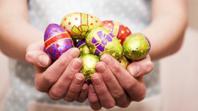 person holding chocolate eggs