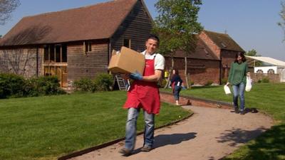 Staff bringing food out to customers