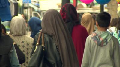 Muslim women in a market in England.