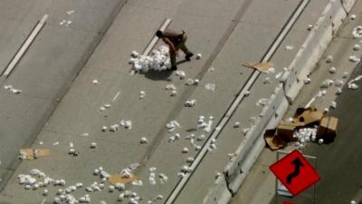 Officers clean up toilet paper spill