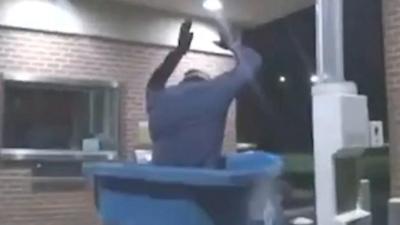 Man falls into bin