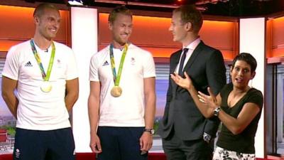 Olympic rowers standing next to Breakfast presenters