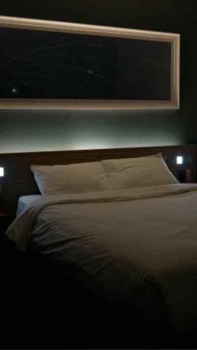 A bed in a hotel room