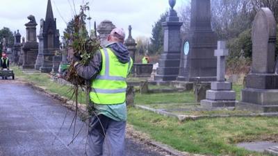 A man working at a cemetery